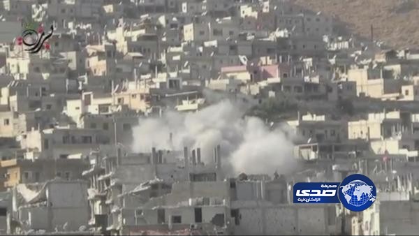 قصف الأسد لحي برزة يدمر ويحرق المنازل