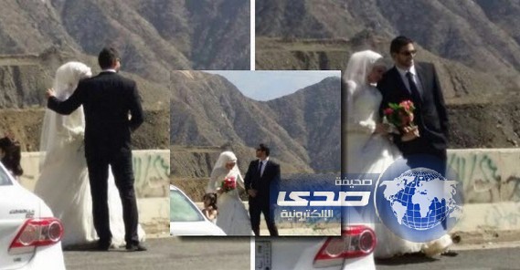فتاه مرتدية ثوب زفافها بصحبة عريسها في الطريق الدولي بعسير