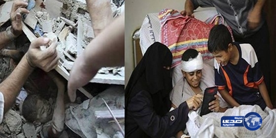 طفل فلسطيني يبتسم وهو يشاهد صورته حين كان تحت الركام (صور)