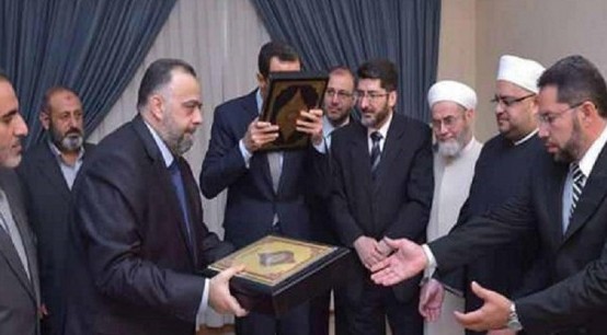 قُبلة تتسبب بحذف صورة للرئيس السوري