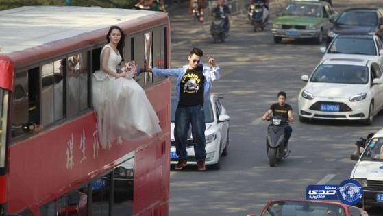 بالصور:عروسان يقيمان زفافهما فى الهواء