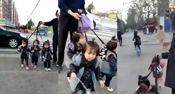 بالفيديو.. رجل يربط أحفاده الثلاثة بحبل أثناء عبوره الطريق