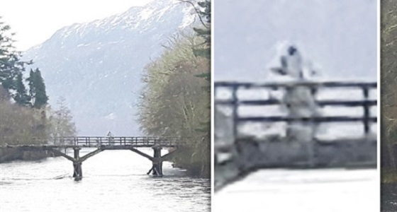 صورة غريبة لرائد فضاء يلوح بيده فوق جسر بحيرة