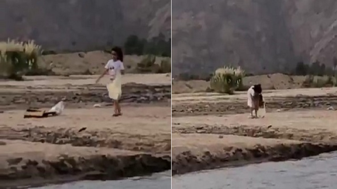 بالفيديو.. طفلة تعطي درساً للكبار وتنظف بقايا المتنزهين على ضقاف وادي نجران