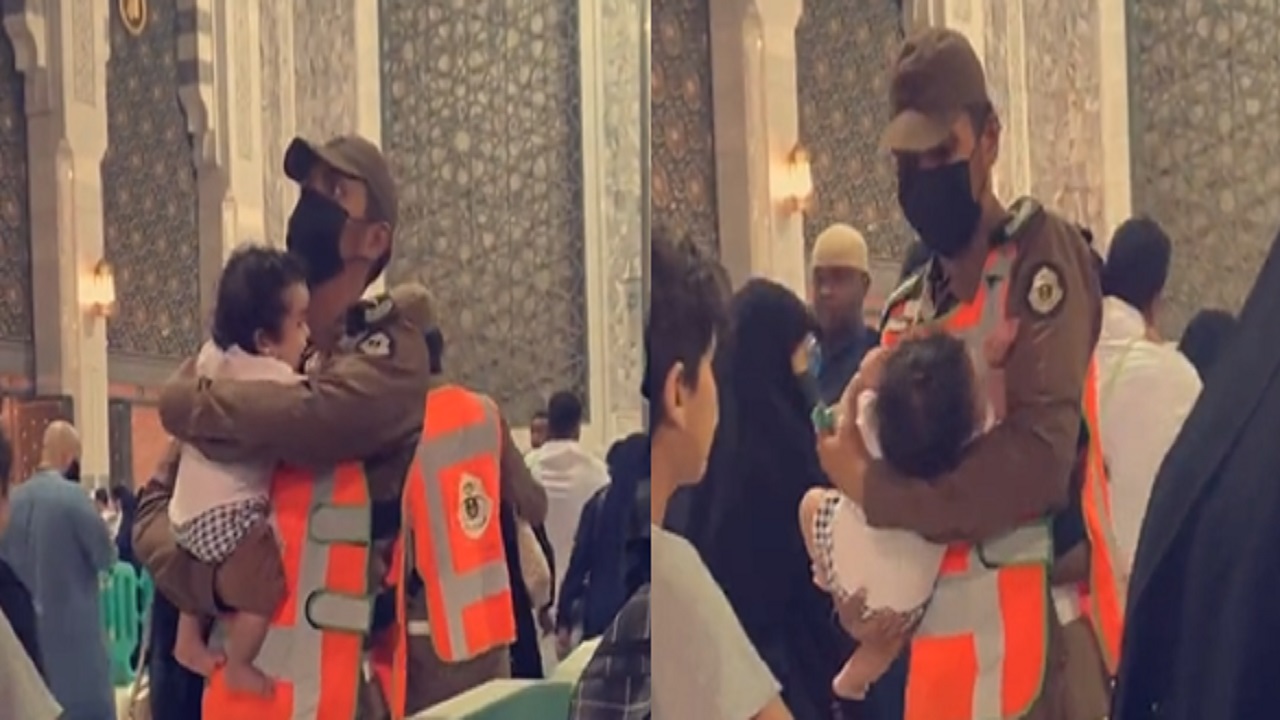 بالفيديو ..  رجل أمن يحمل طفلة تبكي لتتمكن أمها من الصلاة بالمسجد الحرام