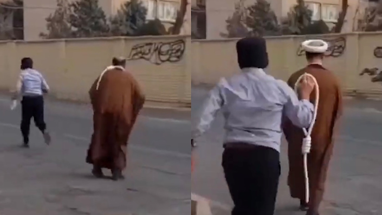 بالفيديو.. رجل إيراني ينزع العمامة من رأس معمم ويضع حبل المشنقة