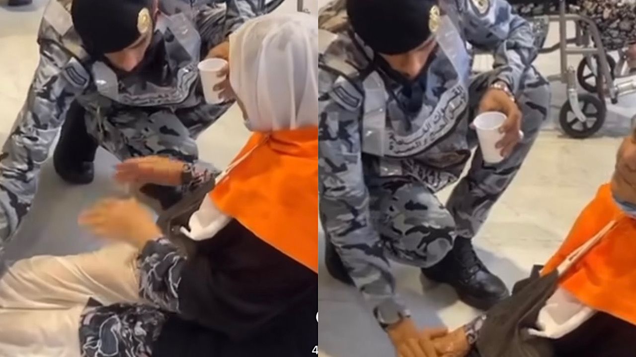 رجل أمن يساعد حاجة تشتكي من أرجلها ويضع الماء عليها لتخفيف ألمها .. فيديو