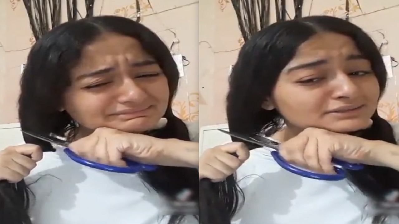 فتاة تقوم بقص شعرها بسبب مجموع الثانوية العامة..فيديو