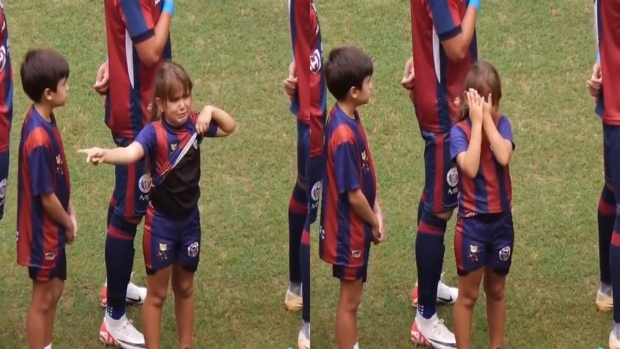 طفلة برازيلية تبكي لوقوفها مع لاعبي الفريق المنافس.. فيديو
