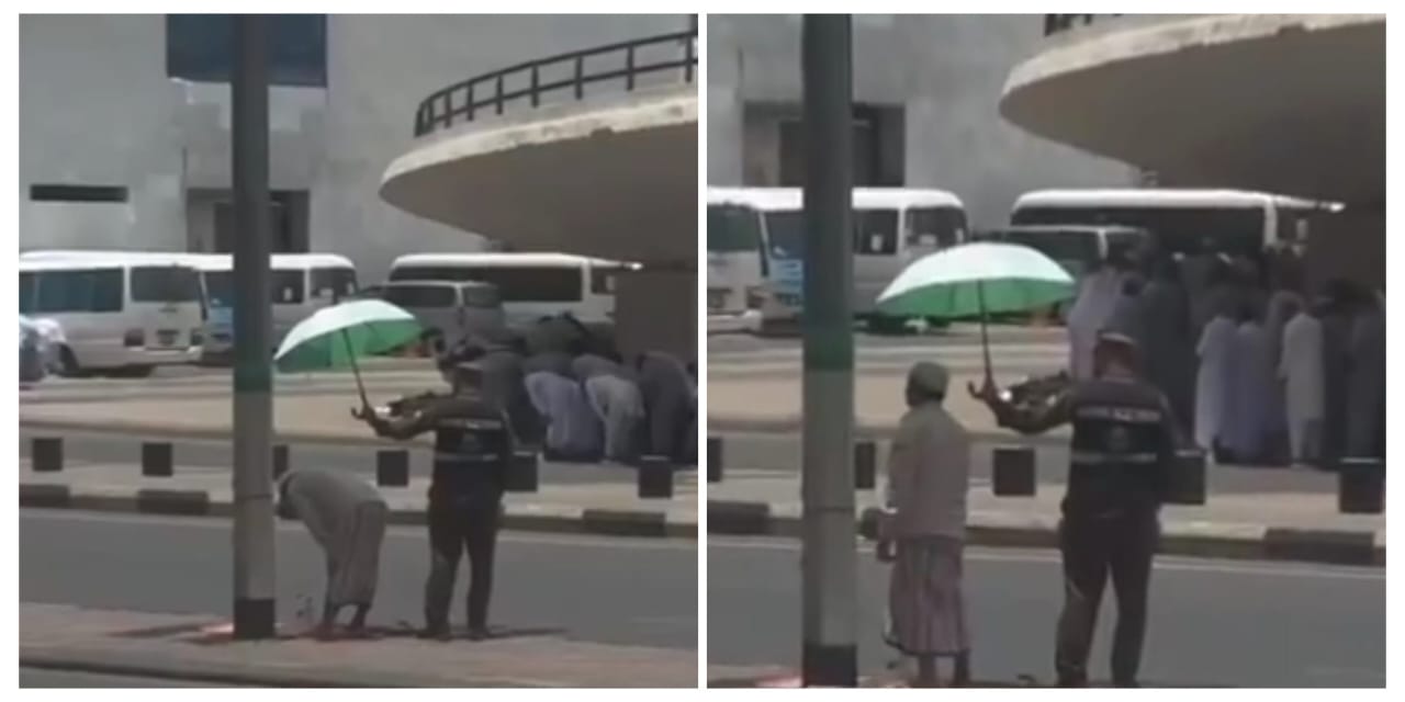 رجل أمن يقف في الشمس ويضلل على أحد الحجاج المصلين… فيديو.
