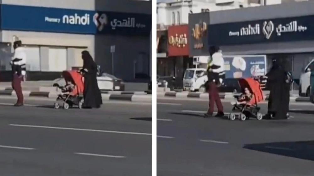 حارس أمن يحصد تفاعل واسع بعد مساعدته امرأة وأطفالها أثناء عبور الشارع .. فيديو