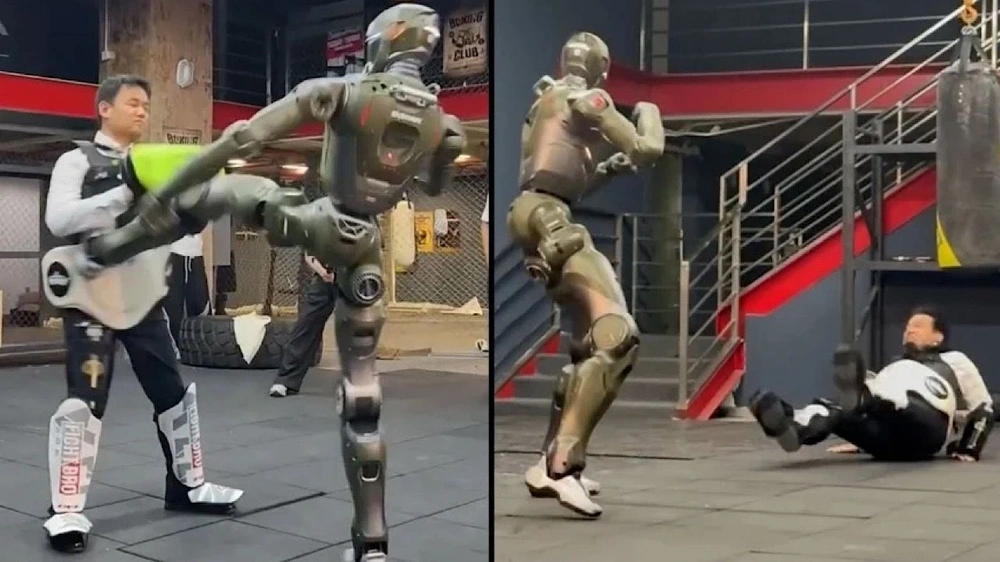 روبوت يهاجم مخترعه ويسقطه أرضاً..فيديو