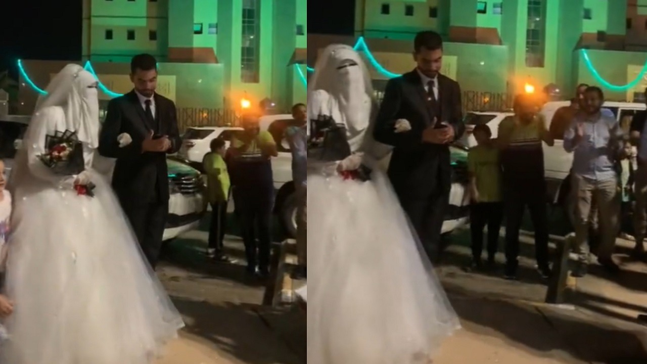 فيديو..عروسان يحتفلان بزفافهما وسط احتفالات اليوم الوطني ببريدة