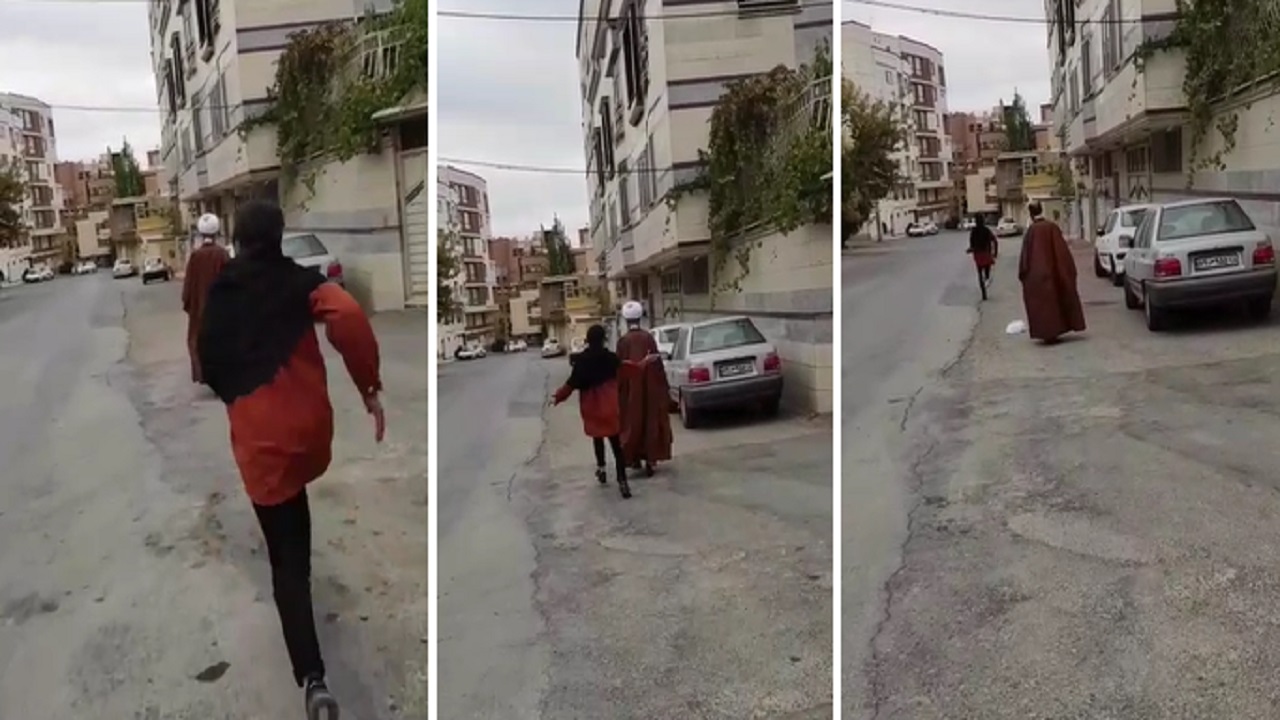 بالفيديو .. فتاة تنزع عمامة معمم في أحد شوارع إيران
