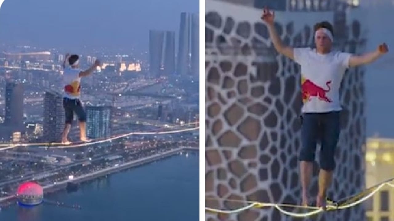 روس يحصد الرقم القياسي في المشي على أطول حبل مضئ بالعالم في قطر.. فيديو